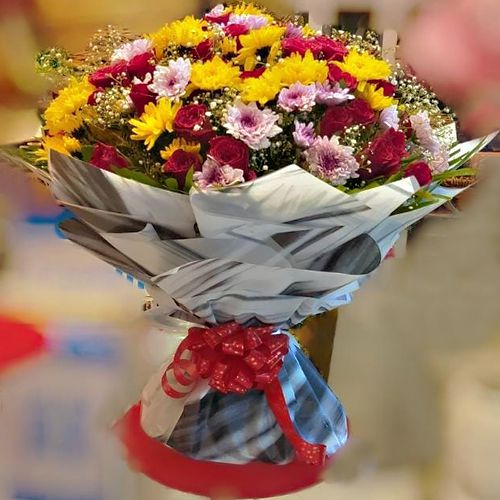 Luxurious Tissue Wrapped Bouquet of Colorful Flowers