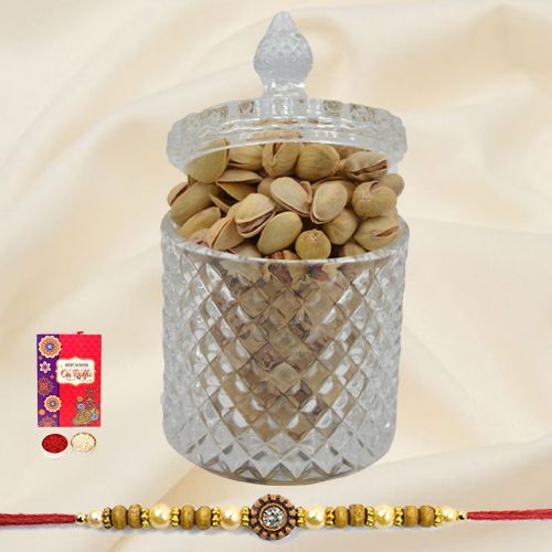 Salted Pistachios in a designer Glass Jar with a Rakhi with free Roli Tilak Chawal